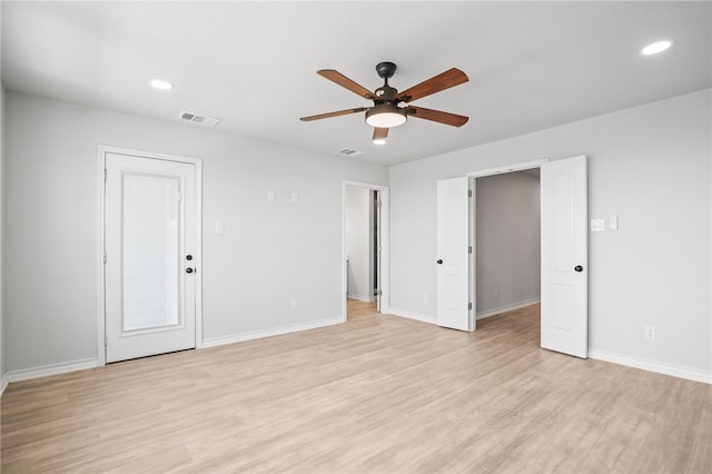 spare room featuring visible vents, baseboards, recessed lighting, light wood-style flooring, and a ceiling fan