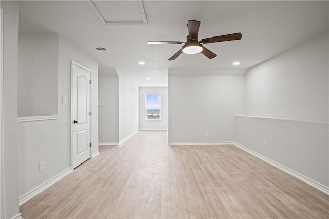 empty room with visible vents, baseboards, recessed lighting, wood finished floors, and a ceiling fan