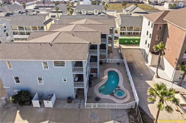 birds eye view of property with a residential view