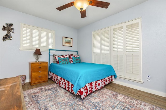 bedroom featuring hardwood / wood-style flooring and ceiling fan