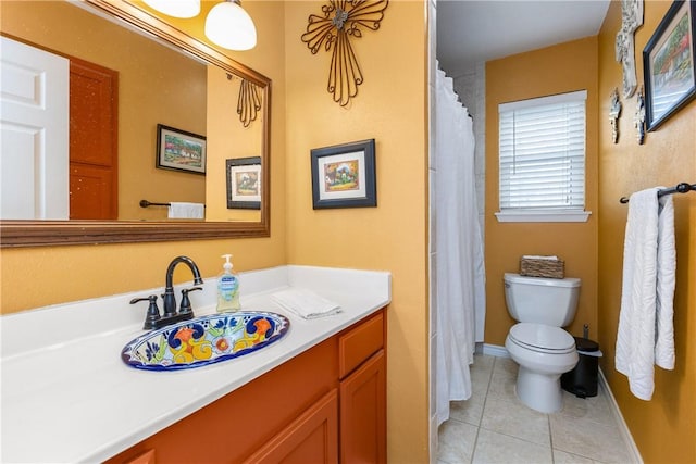 bathroom with tile patterned floors, toilet, and vanity