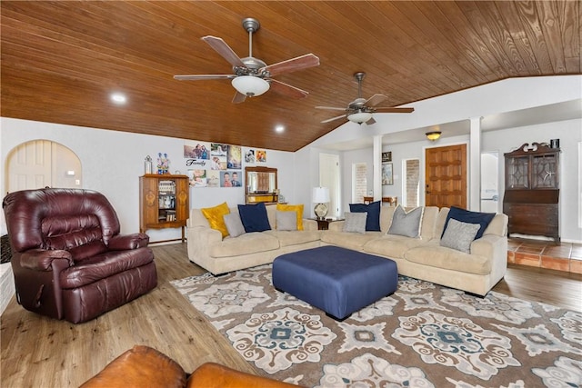 living room featuring ceiling fan, lofted ceiling, wood-type flooring, and wooden ceiling