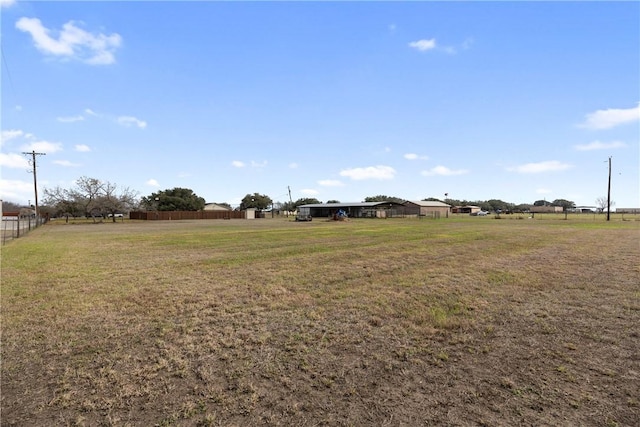 view of yard with a rural view