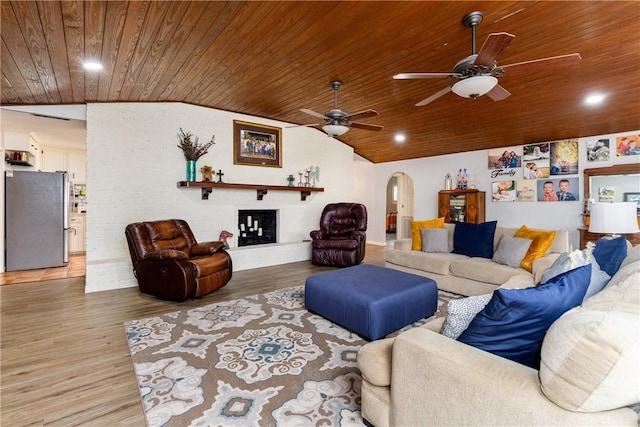 living room with hardwood / wood-style flooring, lofted ceiling, and wood ceiling