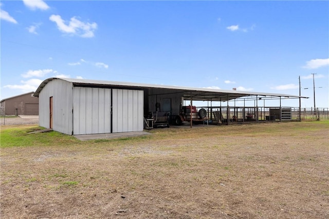 view of outbuilding featuring a yard