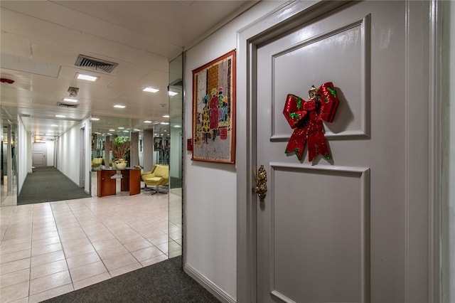 hallway with tile patterned floors