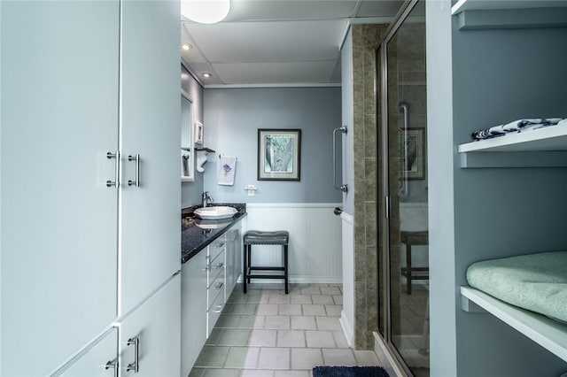 bathroom featuring walk in shower and vanity