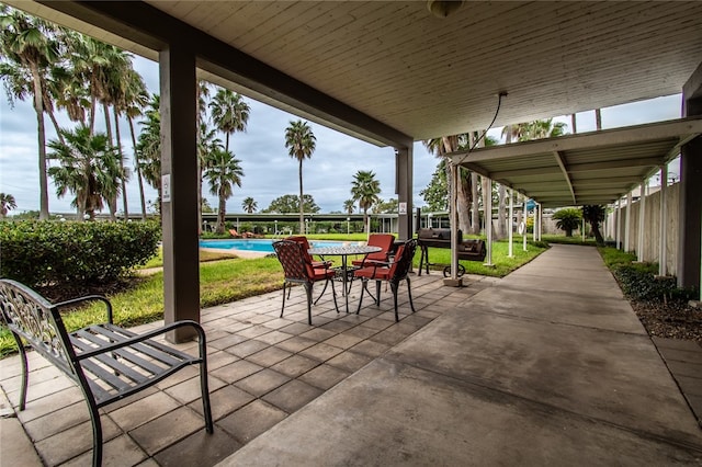 view of patio with a fenced in pool