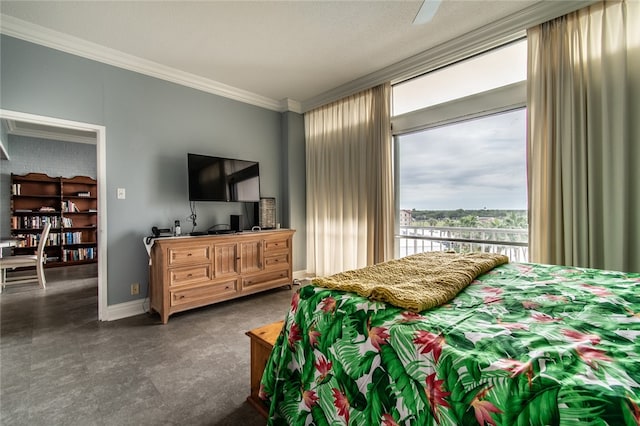 bedroom featuring ceiling fan, a textured ceiling, and ornamental molding