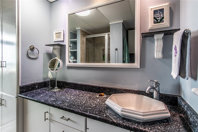 bathroom with an enclosed shower and vanity