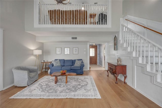 7506 Bistineau Dr, Corpus Christi, TX 78413 - living area with a high ceiling, wood finished floors, and stairway