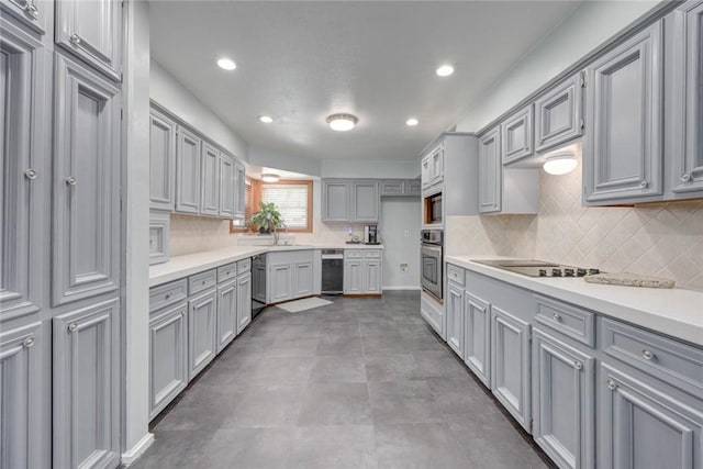 7506 Bistineau Dr, Corpus Christi, TX 78413 - kitchen with black appliances, gray cabinets, decorative backsplash, light countertops, and recessed lighting