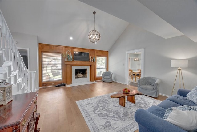 7506 Bistineau Dr, Corpus Christi, TX 78413 - living area featuring plenty of natural light, light wood-style flooring, a chandelier, stairway, and lofted ceiling
