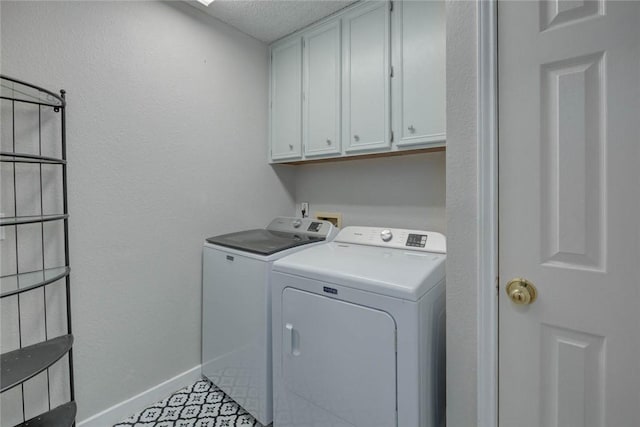 7506 Bistineau Dr, Corpus Christi, TX 78413 - laundry area featuring independent washer and dryer, cabinet space, and a textured ceiling