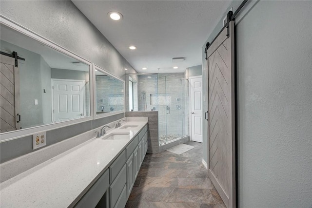 7506 Bistineau Dr, Corpus Christi, TX 78413 - full bath with a shower stall, vanity, recessed lighting, and stone finish floors