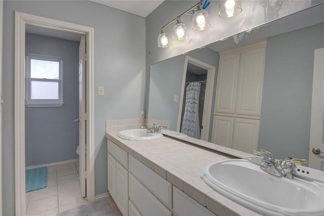 7506 Bistineau Dr, Corpus Christi, TX 78413 - bathroom featuring double vanity and tile patterned floors