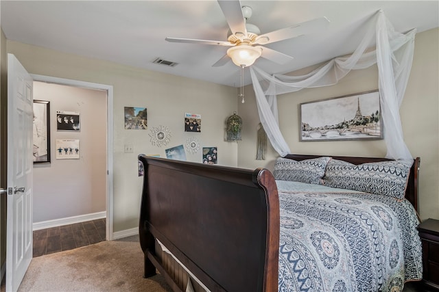 bedroom with hardwood / wood-style floors and ceiling fan