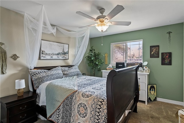 bedroom featuring ceiling fan and carpet