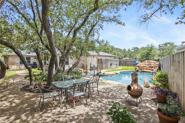 view of swimming pool with a patio