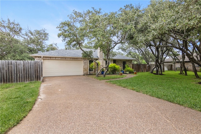 ranch-style house with a garage and a front yard