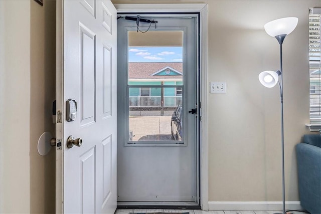 interior space featuring baseboards