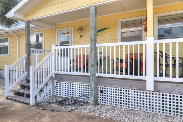 doorway to property featuring a porch