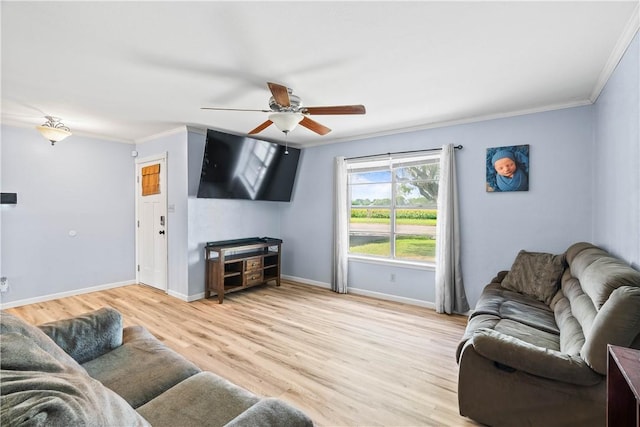 607 E 11th St, Bishop, TX 78343 - living room featuring ceiling fan, crown molding, light wood-type flooring, and baseboards