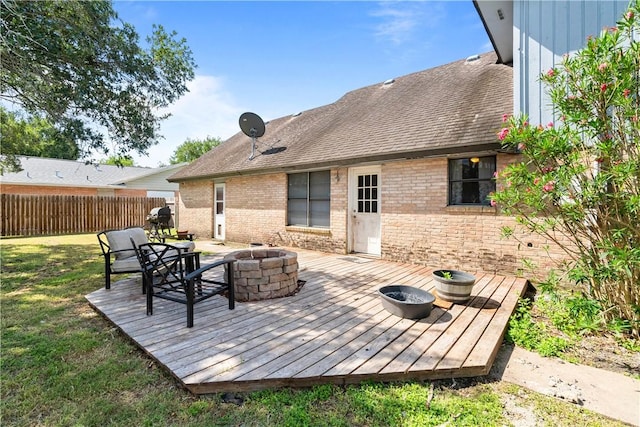 607 E 11th St, Bishop, TX 78343 - wooden deck with a fire pit