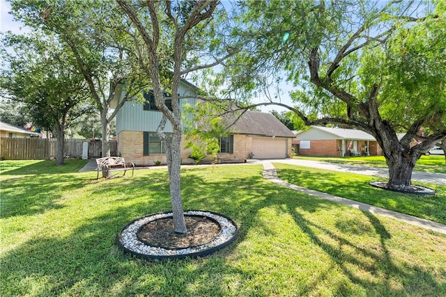 607 E 11th St, Bishop, TX 78343 - view of front facade featuring concrete driveway, brick siding, and a garage
