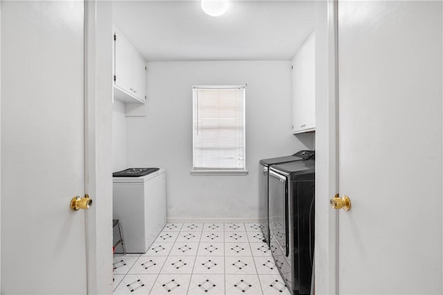 607 E 11th St, Bishop, TX 78343 - laundry area with separate washer and dryer, cabinet space, and baseboards