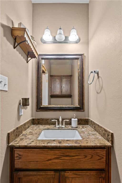 2004 Chesapeake Bay Dr, Portland, TX 78374 - bathroom with vanity and a textured wall