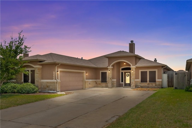 2004 Chesapeake Bay Dr, Portland, TX 78374 - view of front facade featuring stone siding, driveway, and an attached garage
