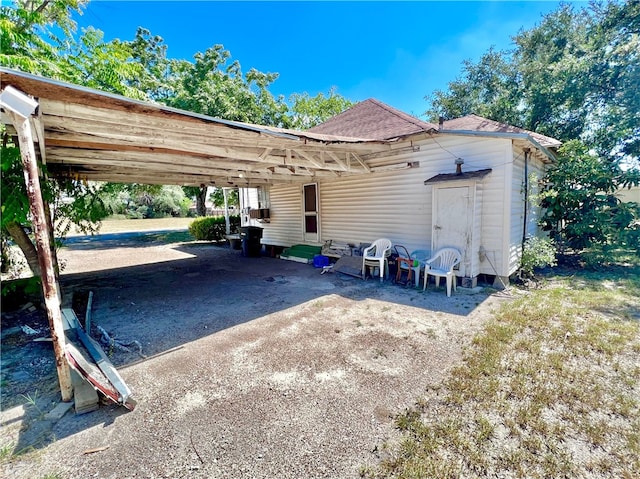 exterior space featuring a carport