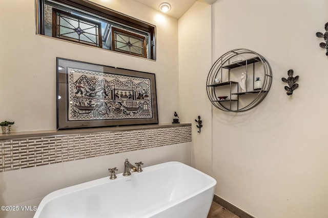 2010 Vermont Rd E, Vail, CO 81657 - bathroom with a soaking tub and wood finished floors