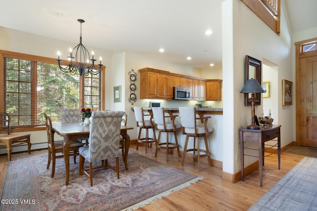 111 Club Cottage Dr, Edwards, CO 81632 - dining room with a chandelier, light wood-style floors, recessed lighting, and baseboard heating