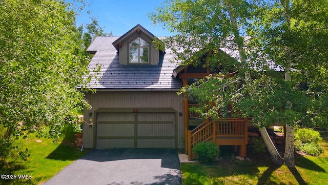 111 Club Cottage Dr, Edwards, CO 81632 - view of front of home with asphalt driveway and a front lawn