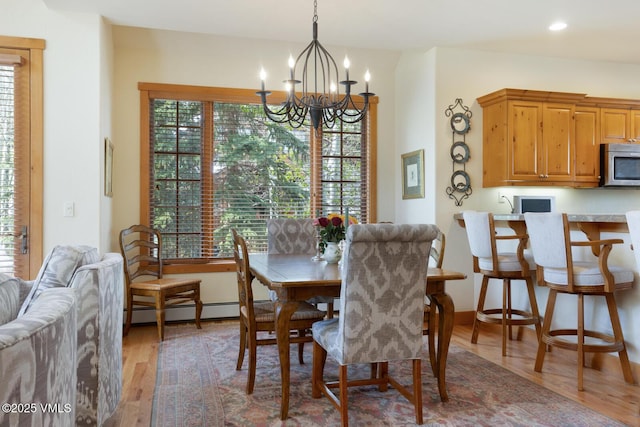 111 Club Cottage Dr, Edwards, CO 81632 - dining space with a chandelier, a baseboard radiator, light wood-type flooring, and recessed lighting