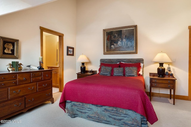 111 Club Cottage Dr, Edwards, CO 81632 - bedroom with light carpet, lofted ceiling, and ensuite bath