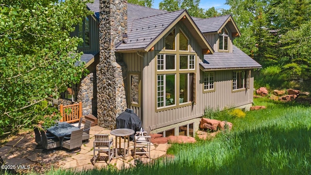 111 Club Cottage Dr, Edwards, CO 81632 - back of house with board and batten siding and a patio area