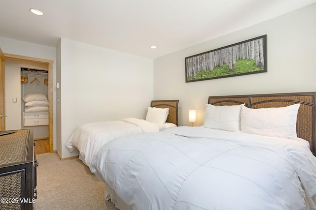 bedroom featuring light carpet, baseboards, and recessed lighting