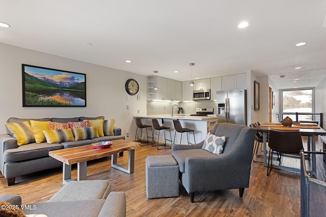 living room featuring wood finished floors and recessed lighting