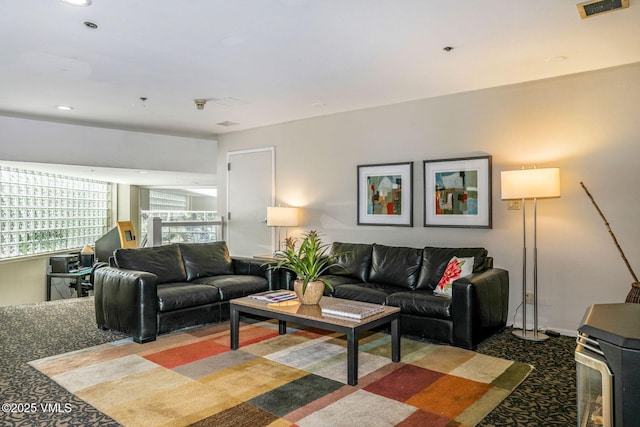 living room with recessed lighting and visible vents