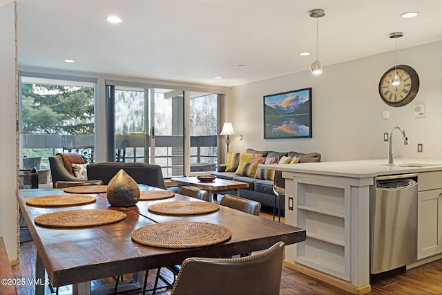 dining area with floor to ceiling windows, dark wood-type flooring, and recessed lighting