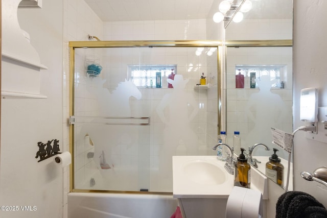 bathroom featuring enclosed tub / shower combo, plenty of natural light, and vanity