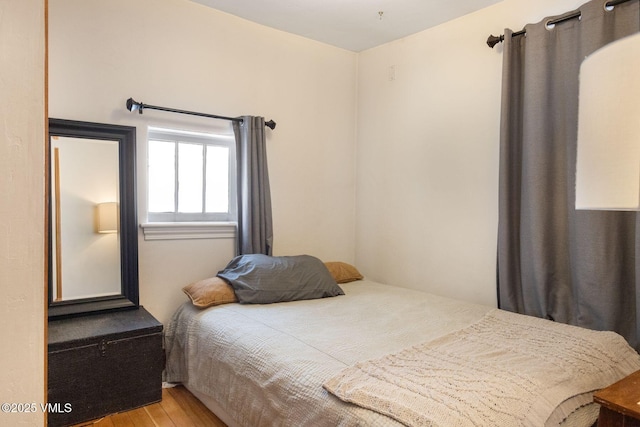 bedroom featuring wood finished floors