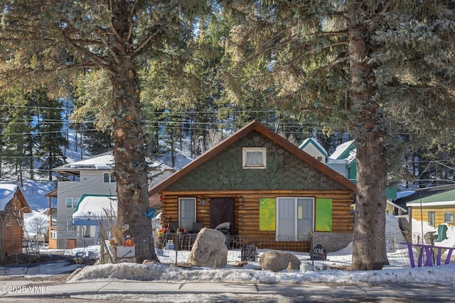 cabin featuring log siding