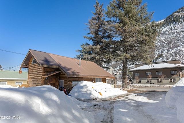 view of front of house featuring log exterior