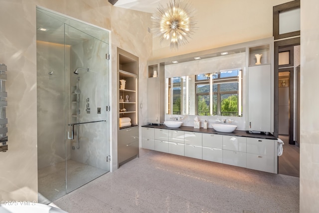 455 Old Creamery Rd, Edwards, CO 81632 - bathroom with double vanity, a shower stall, and a chandelier
