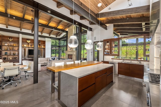 455 Old Creamery Rd, Edwards, CO 81632 - kitchen with a wooden ceiling with exposed beams, modern cabinets, open floor plan, a kitchen island, and high vaulted ceiling