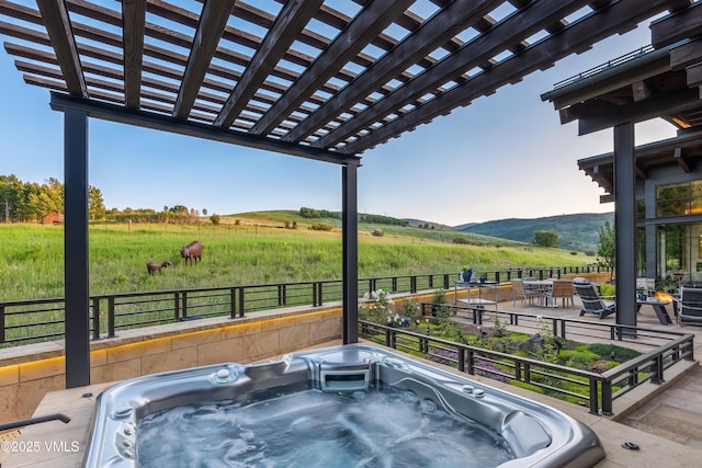 455 Old Creamery Rd, Edwards, CO 81632 - view of patio with a rural view, a hot tub, a pergola, and a mountain view